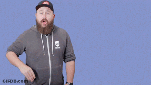 A Man With A Beard Wearing A Hat And A Hoodie That Says Are You On Mute GIF