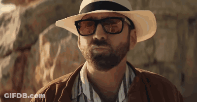 A Man With A Beard Wearing A Hat And Glasses GIF
