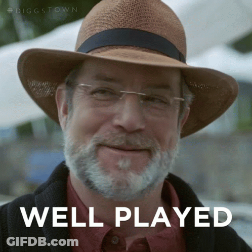 A Man With A Beard Wearing A Hat And Glasses Says " Well Played " GIF