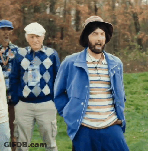 A Man With A Beard Wearing A Hat And Striped Shirt GIF