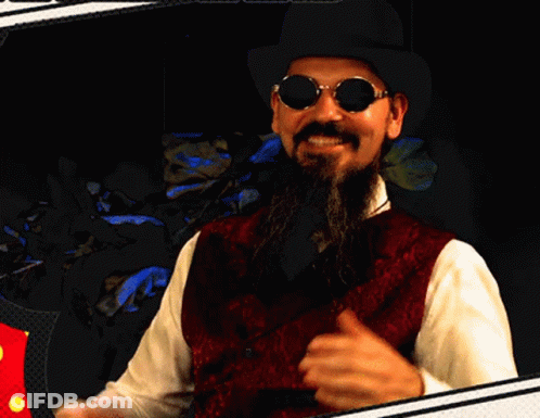 A Man With A Beard Wearing A Hat And Sunglasses GIF