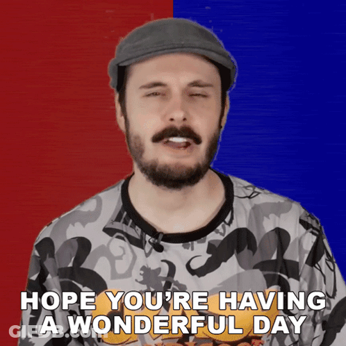 A Man With A Beard Wearing A Hat Says Hope You 'Re Having A Wonderful Day GIF