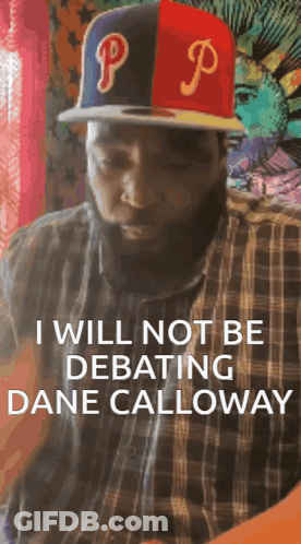 A Man With A Beard Wearing A Hat With The Letter P On It GIF
