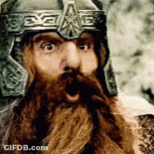 A Man With A Beard Wearing A Helmet Has His Mouth Open GIF
