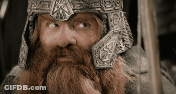 A Man With A Beard Wearing A Helmet That Says ' X ' On It GIF