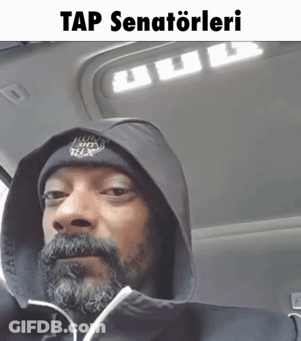 A Man With A Beard Wearing A Hooded Jacket And A Beanie Says Tap Senatoleri On The Bottom GIF