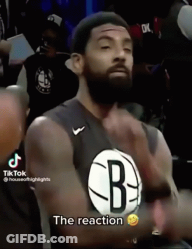 A Man With A Beard Wearing A Jersey That Says The Reaction GIF