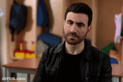 A Man With A Beard Wearing A Leather Jacket GIF