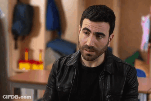 A Man With A Beard Wearing A Leather Jacket GIF