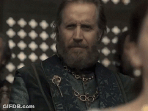 A Man With A Beard Wearing A Necklace With Keys On It GIF
