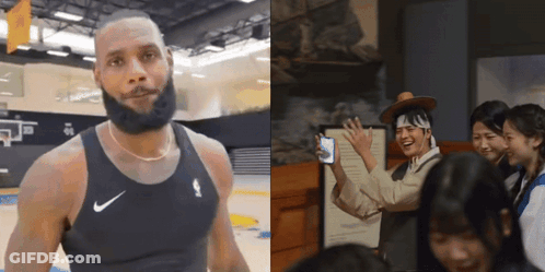 A Man With A Beard Wearing A Nike Tank Top Stands Next To A Group Of People GIF