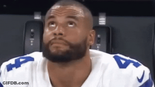 A Man With A Beard Wearing A Number 4 Jersey Looks Up GIF