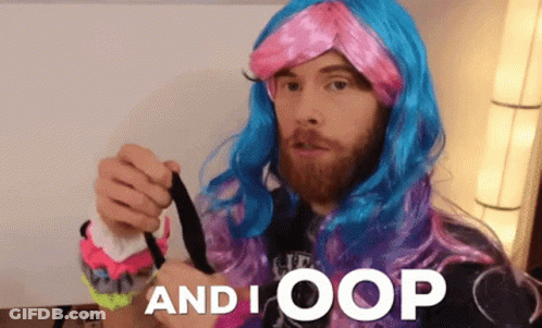 A Man With A Beard Wearing A Pink And Blue Wig With The Words And I Oop Below Him GIF