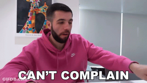 A Man With A Beard Wearing A Pink Nike Hoodie Says " Can 'T Complain " GIF