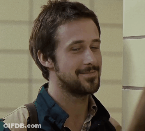 A Man With A Beard Wearing A Plaid Shirt And A Green Jacket GIF