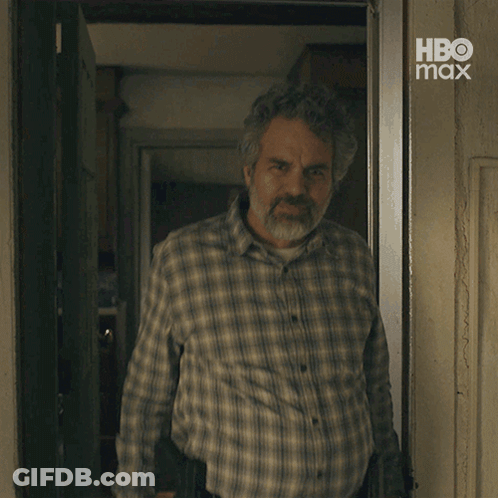 A Man With A Beard Wearing A Plaid Shirt With Hbo Max Written On The Bottom GIF