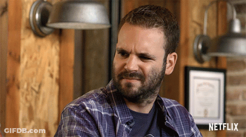 Bearded Man In Plaid Shirt With Netflix Logo GIF