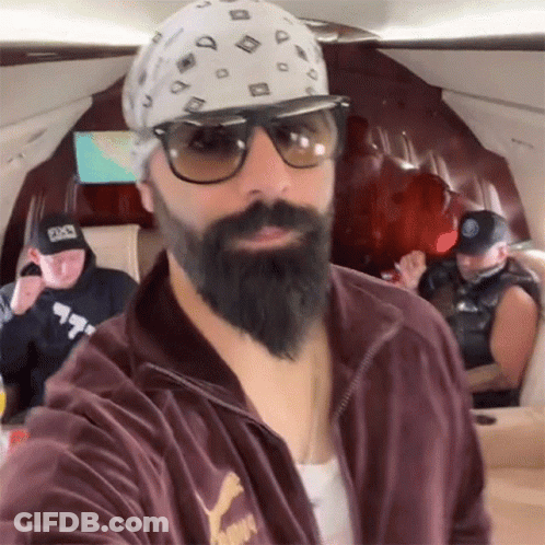 A Man With A Beard Wearing A Puma Jacket GIF