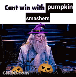 A Man With A Beard Wearing A Purple Hat With Pumpkins In The Background GIF