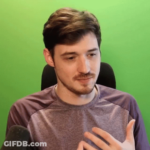 Man With Beard In Purple Shirt In Front Of Green Screen GIF