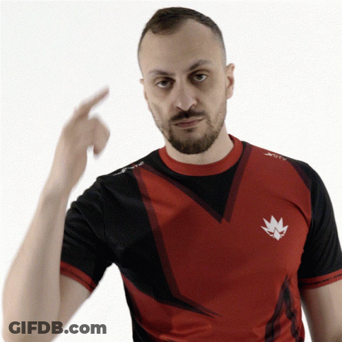 A Man With A Beard Wearing A Red And Black Shirt That Says Xtc GIF