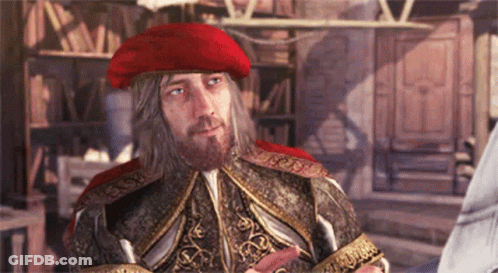 A Man With A Beard Wearing A Red Hat And A Fancy Costume GIF