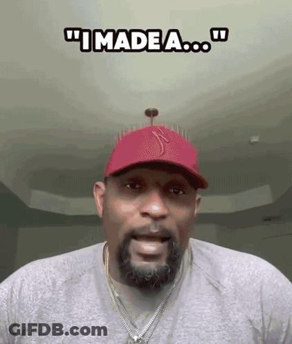 A Man With A Beard Wearing A Red Hat And A Necklace Says " I Made A ... " GIF