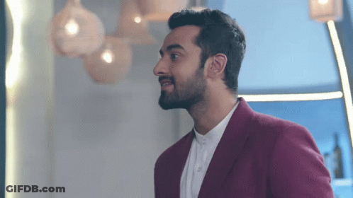 A Man With A Beard Wearing A Red Jacket GIF