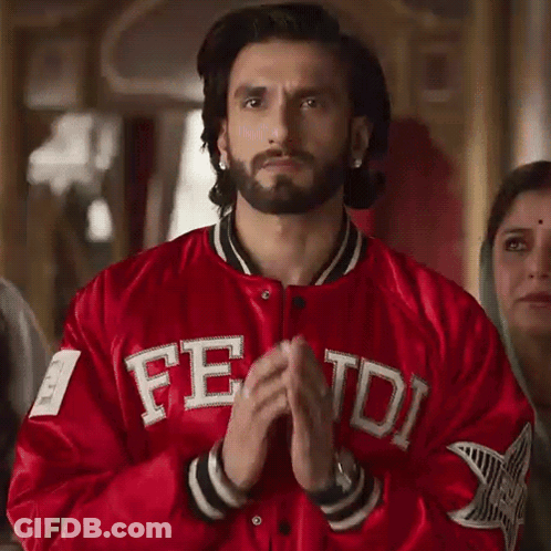A Man With A Beard Wearing A Red Jacket With The Word Fred On It GIF