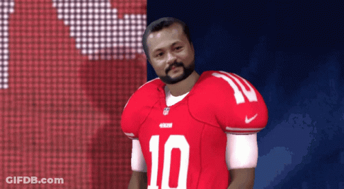 A Man With A Beard Wearing A Red Jersey With The Number 10 On It GIF