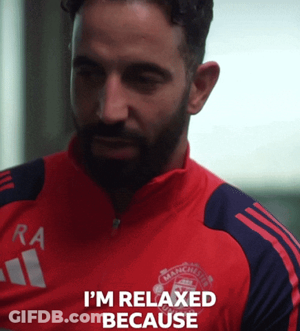A Man With A Beard Wearing A Red Manchester United Shirt GIF