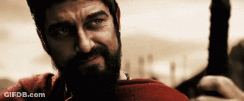 A Man With A Beard Wearing A Red Shirt GIF
