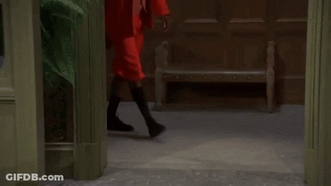 A Man With A Beard Wearing A Red Suit And Sunglasses GIF