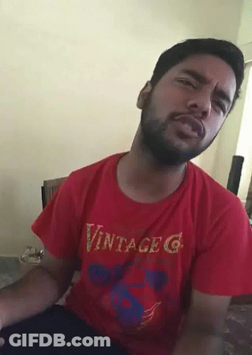 A Man With A Beard Wearing A Red Vintage G T-Shirt GIF
