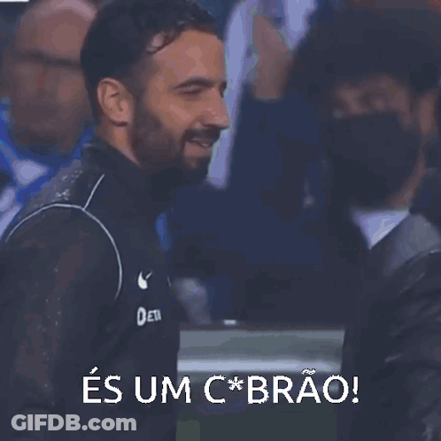 A Man With A Beard Wearing A Scp Jacket Is Smiling GIF