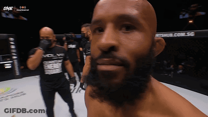 A Man With A Beard Wearing A Shirt That Says Evolve GIF