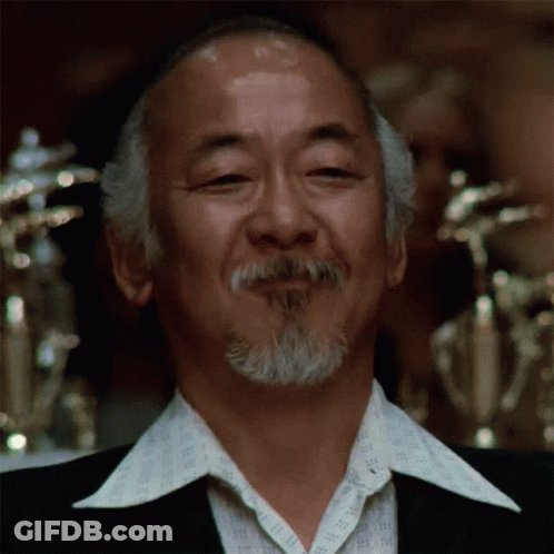 A Man With A Beard Wearing A Shirt That Says ' Ii ' On It GIF