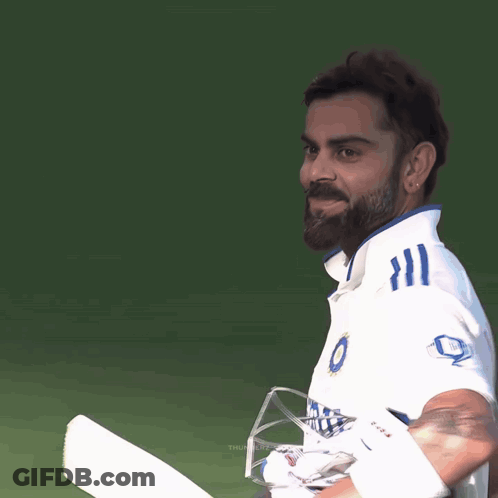 A Man With A Beard Wearing A Shirt That Says Peacock GIF