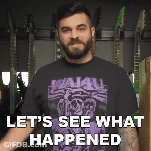 A Man With A Beard Wearing A Shirt That Says Wai4u GIF