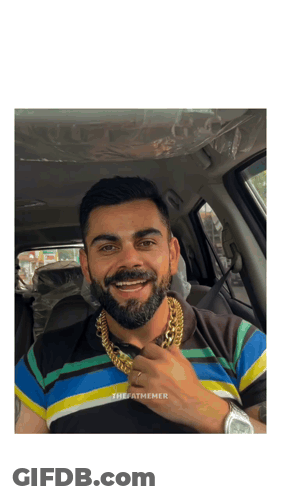 A Man With A Beard Wearing A Striped Shirt And A Gold Chain Around His Neck GIF