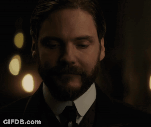 Bearded Man In Suit Looking Down GIF