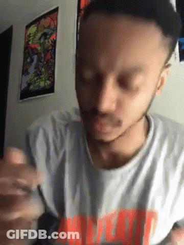 A Man With A Beard Wearing A T-Shirt That Says ' Meat ' GIF