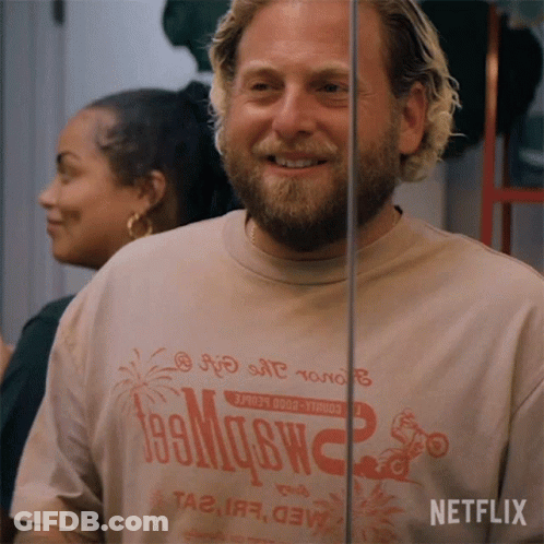 A Man With A Beard Wearing A T-Shirt That Says Netflix GIF