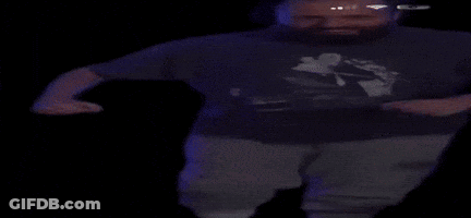A Man With A Beard Wearing A T-Shirt With A Picture Of A Man On It GIF