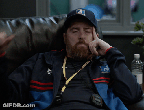 A Man With A Beard Wearing A Teddy Bear Hat Giving A Thumbs Down Sign GIF