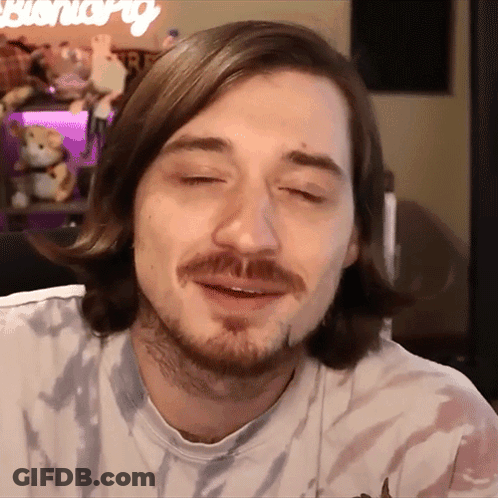 Man With Beard Wearing Tie Dye Shirt With Bunny GIF