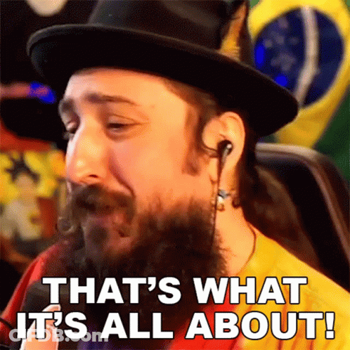 A Man With A Beard Wearing A Top Hat And Earbuds Says That 'S What It 'S All About GIF