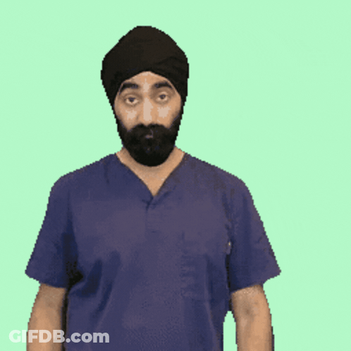 A Man With A Beard Wearing A Turban And Scrubs Is Making A Gesture With His Hands GIF