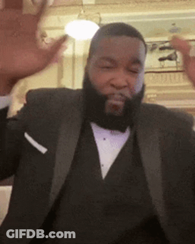 A Man With A Beard Wearing A Tuxedo And A White Pocket Square GIF
