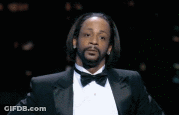 A Man With A Beard Wearing A Tuxedo And Bow Tie Is Making A Funny Face . GIF